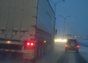 Tractor Trailer and a Car on the Highway